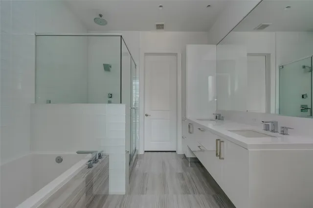 a view of a room with wooden floor and windows