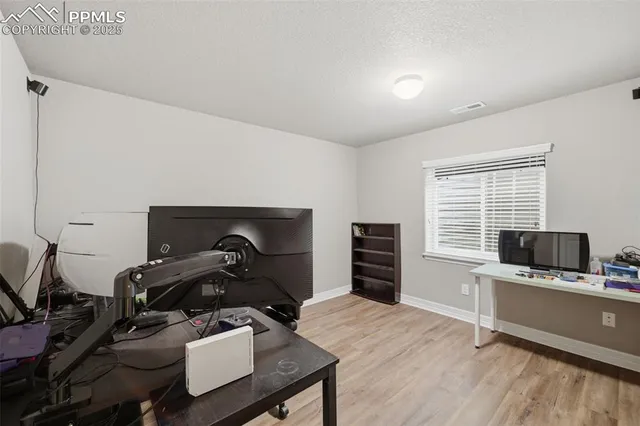 a room with furniture and a flat screen tv