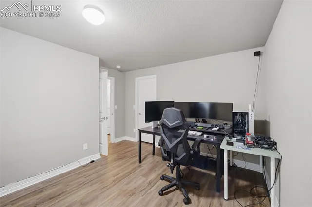 a workspace with furniture and wooden floor
