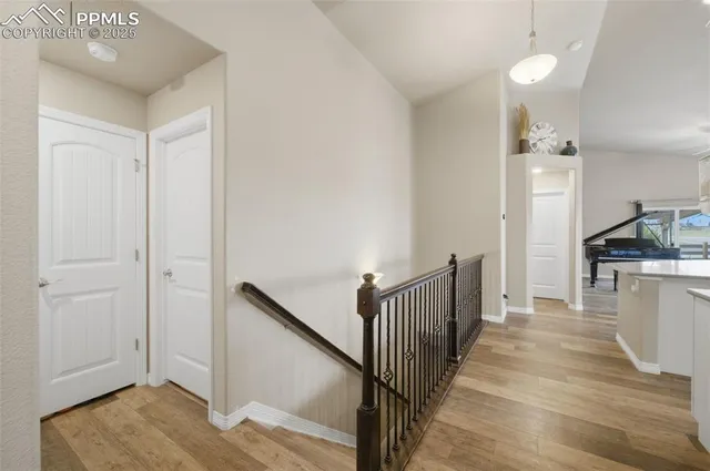 a view of a kitchen with a sink and refrigerator
