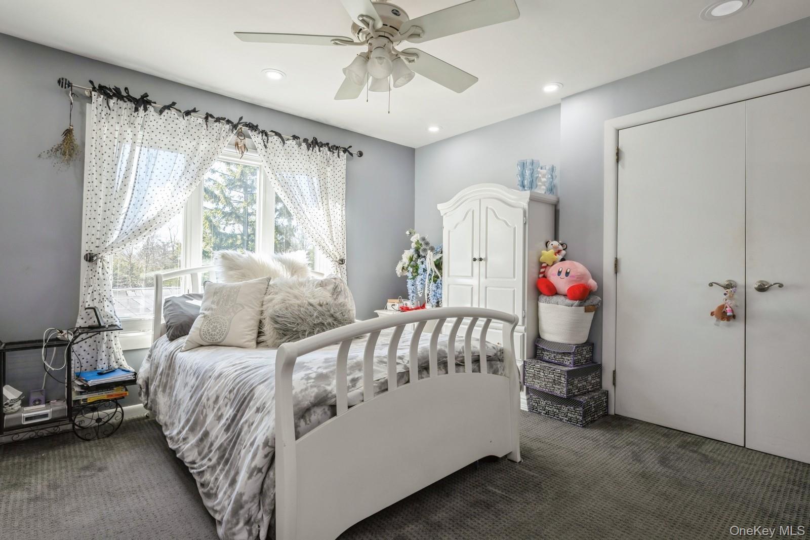 123 Barrett Road Lawrence, NY 11559 - Photo 13 of 32 a bedroom with a bed and a window