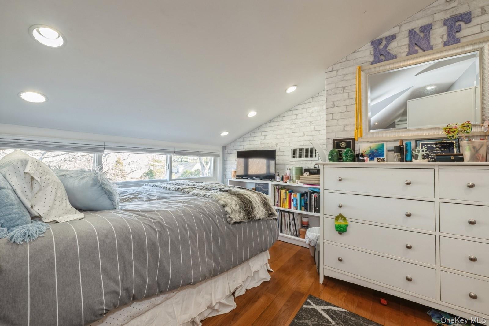 123 Barrett Road Lawrence, NY 11559 - Photo 19 of 32 a bedroom with a bed and a dresser