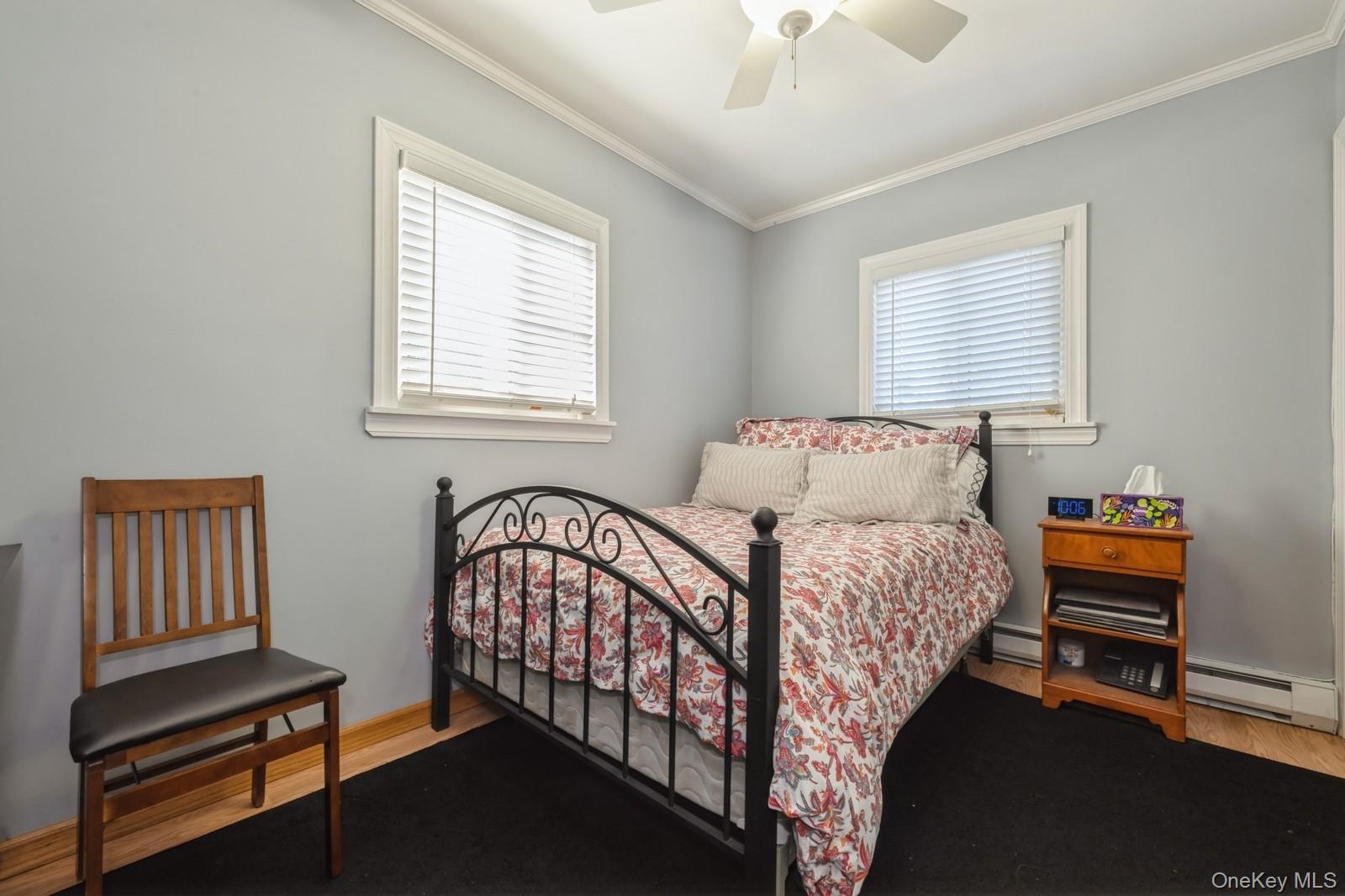 123 Barrett Road Lawrence, NY 11559 - Photo 20 of 32 a bedroom with a bed and a window