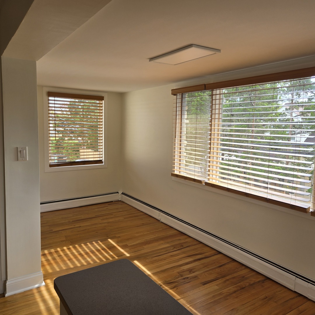 1817 West Touhy Avenue, Unit 2E Park Ridge, IL 60068 - Photo 12 of 19 a view of an empty room with a window