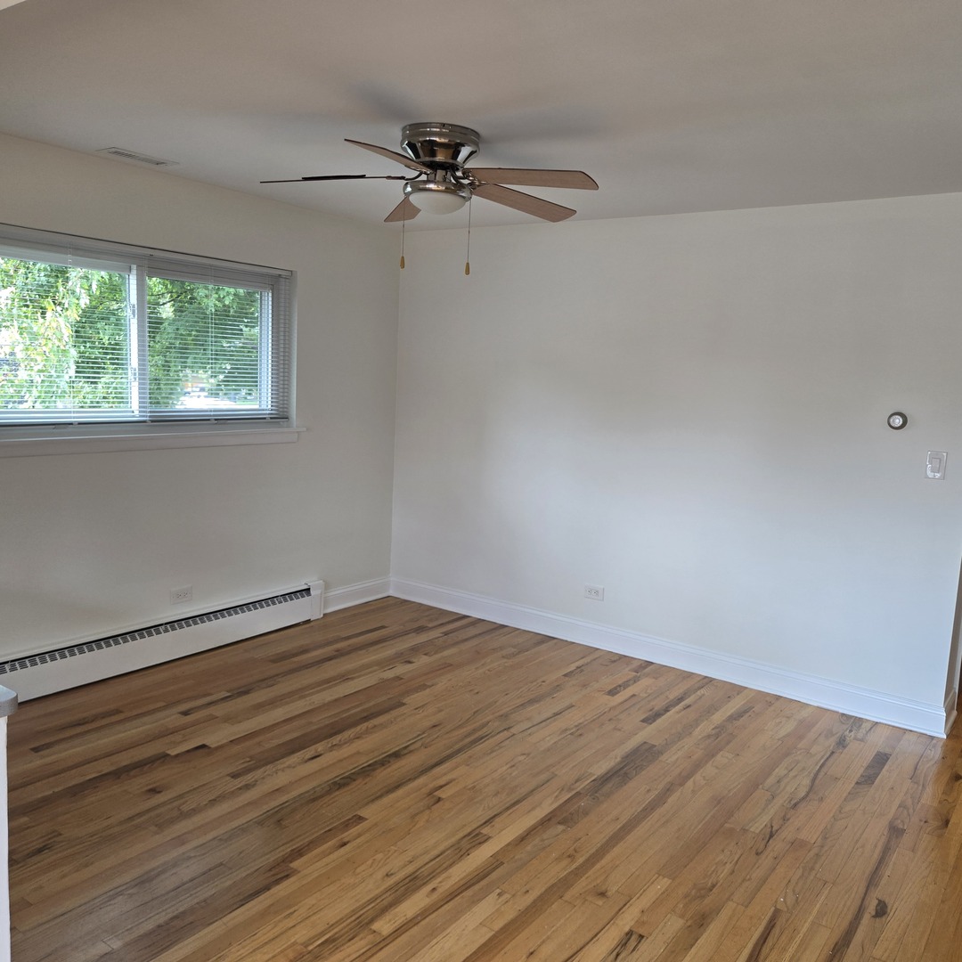 1817 West Touhy Avenue, Unit 2E Park Ridge, IL 60068 - Photo 16 of 19 a view of an empty room with a window
