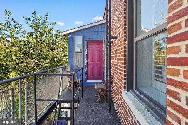 a view of balcony with furniture