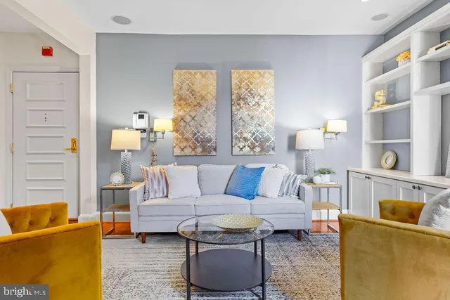 a living room with furniture and a large window