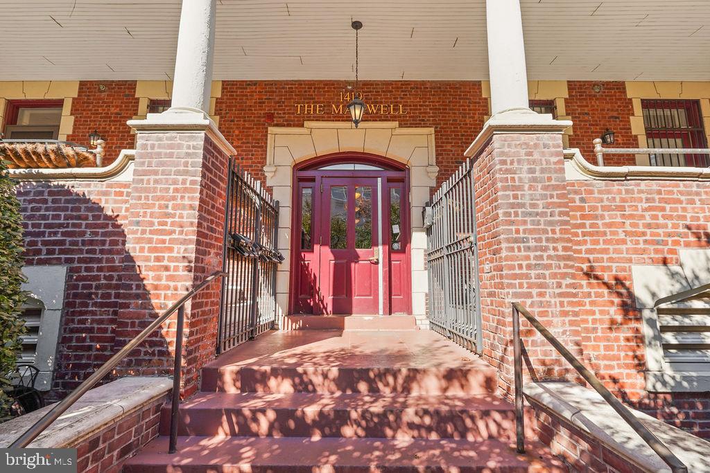 1419 Clifton Street Northwest, Unit 304 Washington, DC 20009 - Photo 21 of 22 a front view of a house with a yard