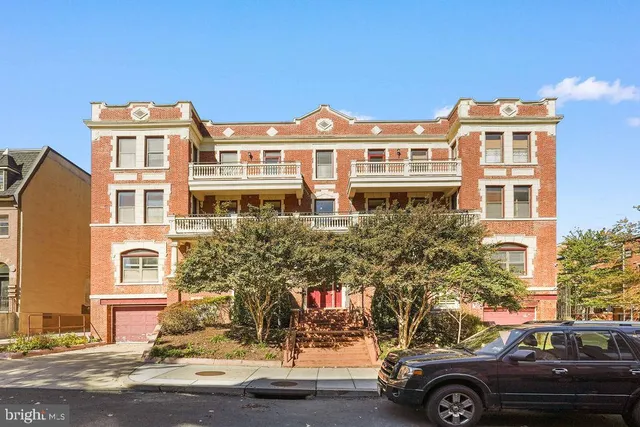 a front view of a building with a parking space
