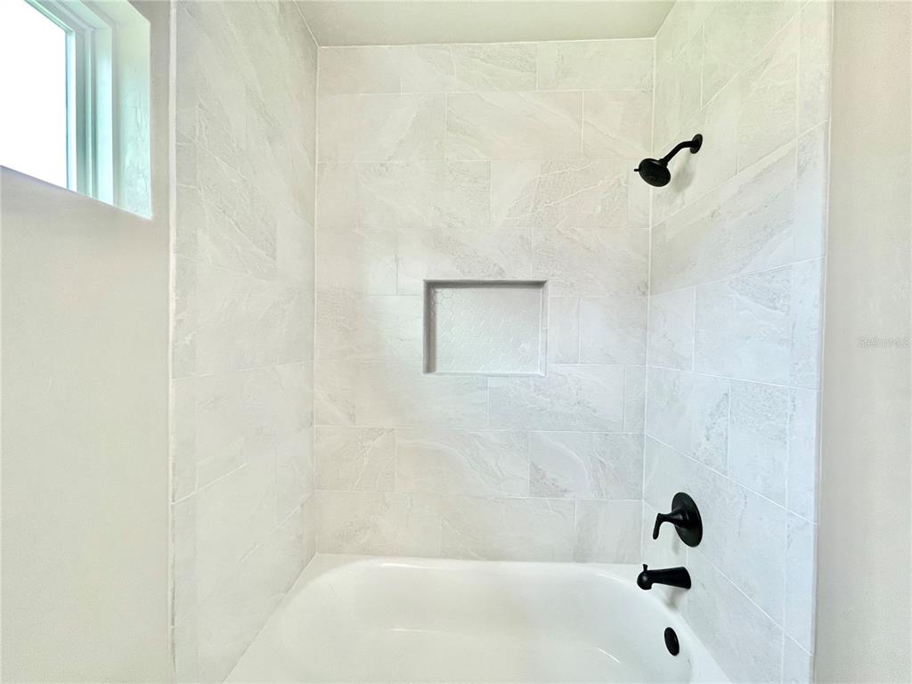 1021 Southwest 67th Street Gainesville, FL 32607 - Photo 27 of 53 a bathroom with a bathtub