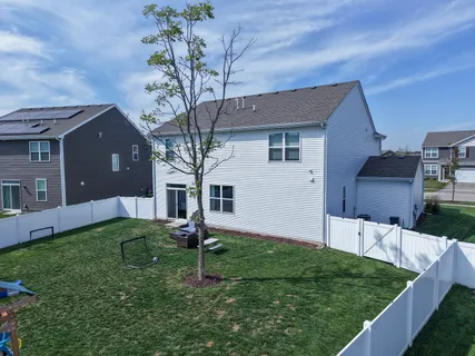 a front view of house with a garden