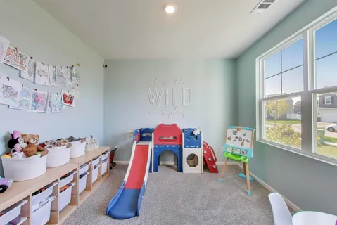 a view of a hallway with entryway wooden floor and front door