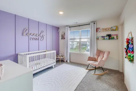a bedroom with furniture and a window