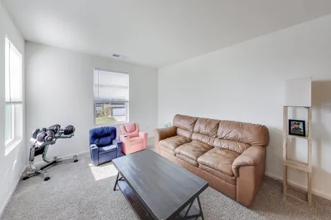 a living room with a couch and a window