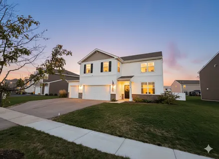 a living room with furniture a dining table and chairs
