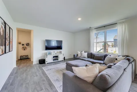 a view of a livingroom with furniture and toys