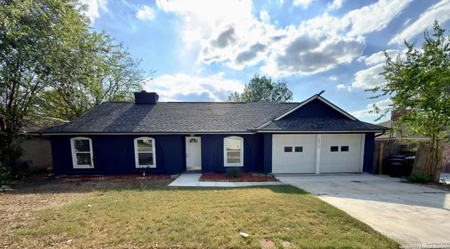 front view of a house with a yard