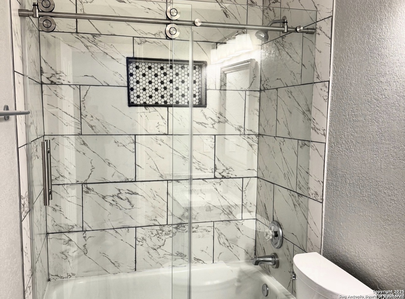 14519 Ridge Meadow Drive San Antonio, TX 78233 - Photo 16 of 25 a bathroom with a toilet and a shower