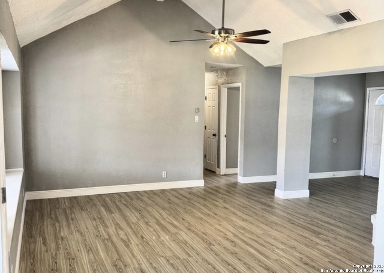 14519 Ridge Meadow Drive San Antonio, TX 78233 - Photo 17 of 25 wooden floor in an empty room with a window