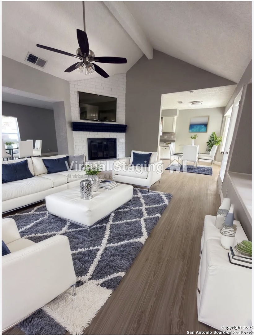 14519 Ridge Meadow Drive San Antonio, TX 78233 - Photo 3 of 25 a living room with furniture and a fireplace