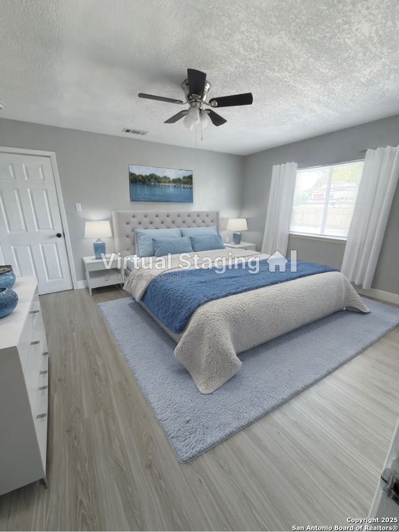 14519 Ridge Meadow Drive San Antonio, TX 78233 - Photo 6 of 25 a spacious bedroom with a bed and a couch