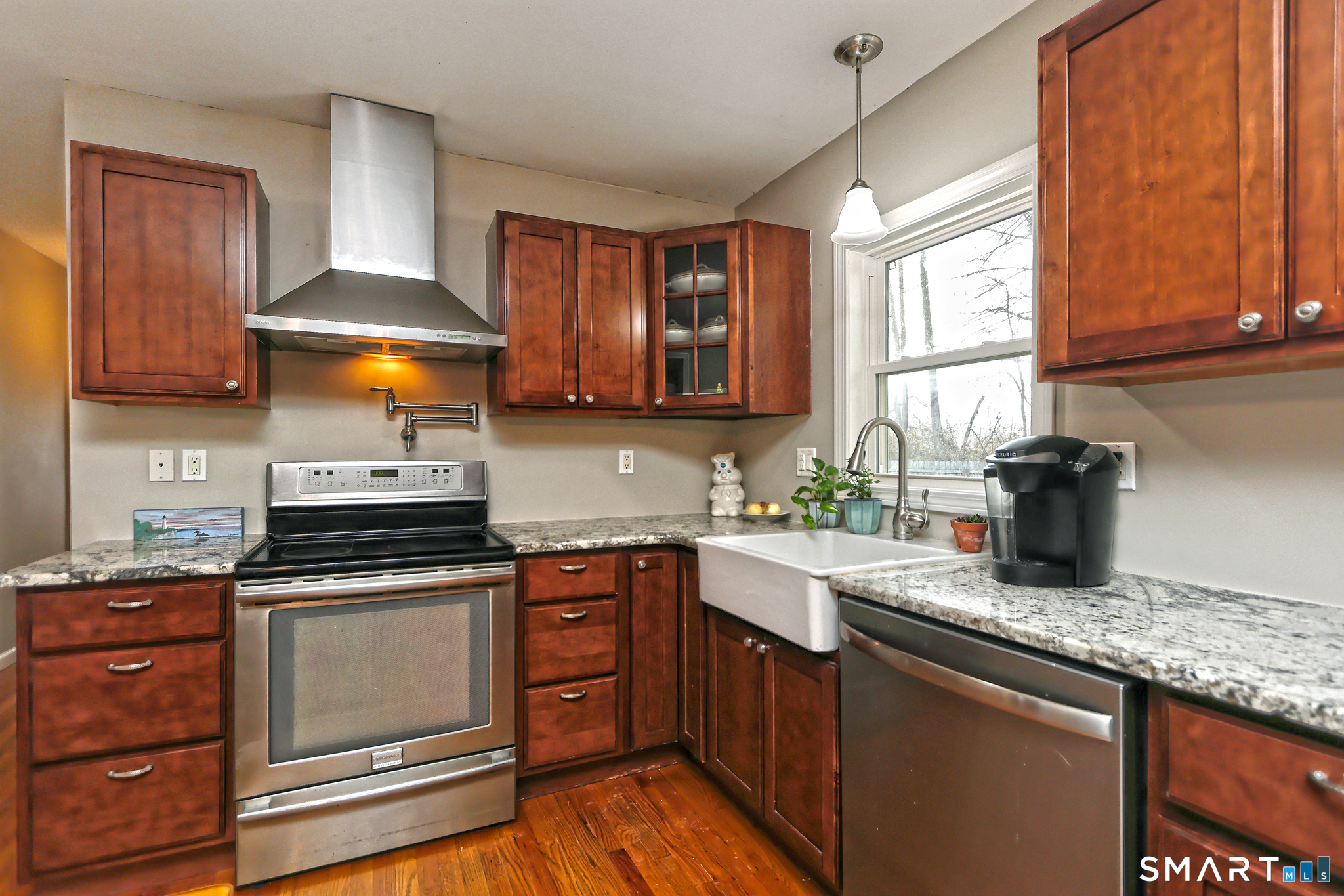53 Pheasant Road West Haven, CT 06516 - Photo 11 of 39 a kitchen with a sink a stove and cabinets