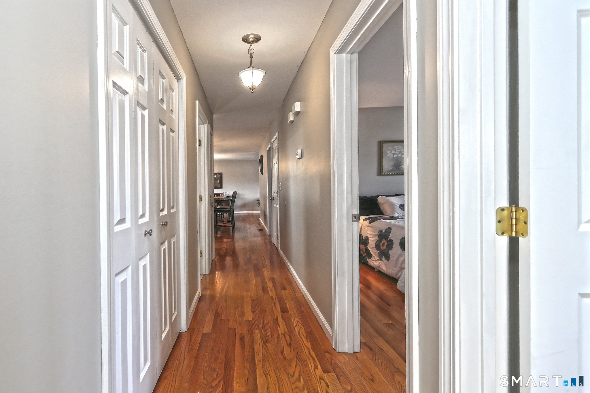 53 Pheasant Road West Haven, CT 06516 - Photo 14 of 39 a view of a hallway with wooden floor and staircase