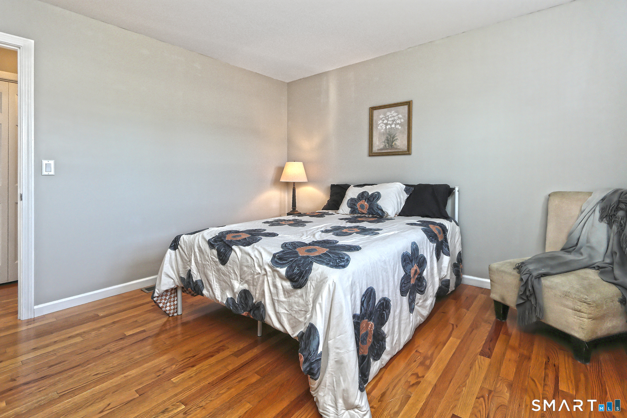 53 Pheasant Road West Haven, CT 06516 - Photo 16 of 39 a bed room with a bed and a chair