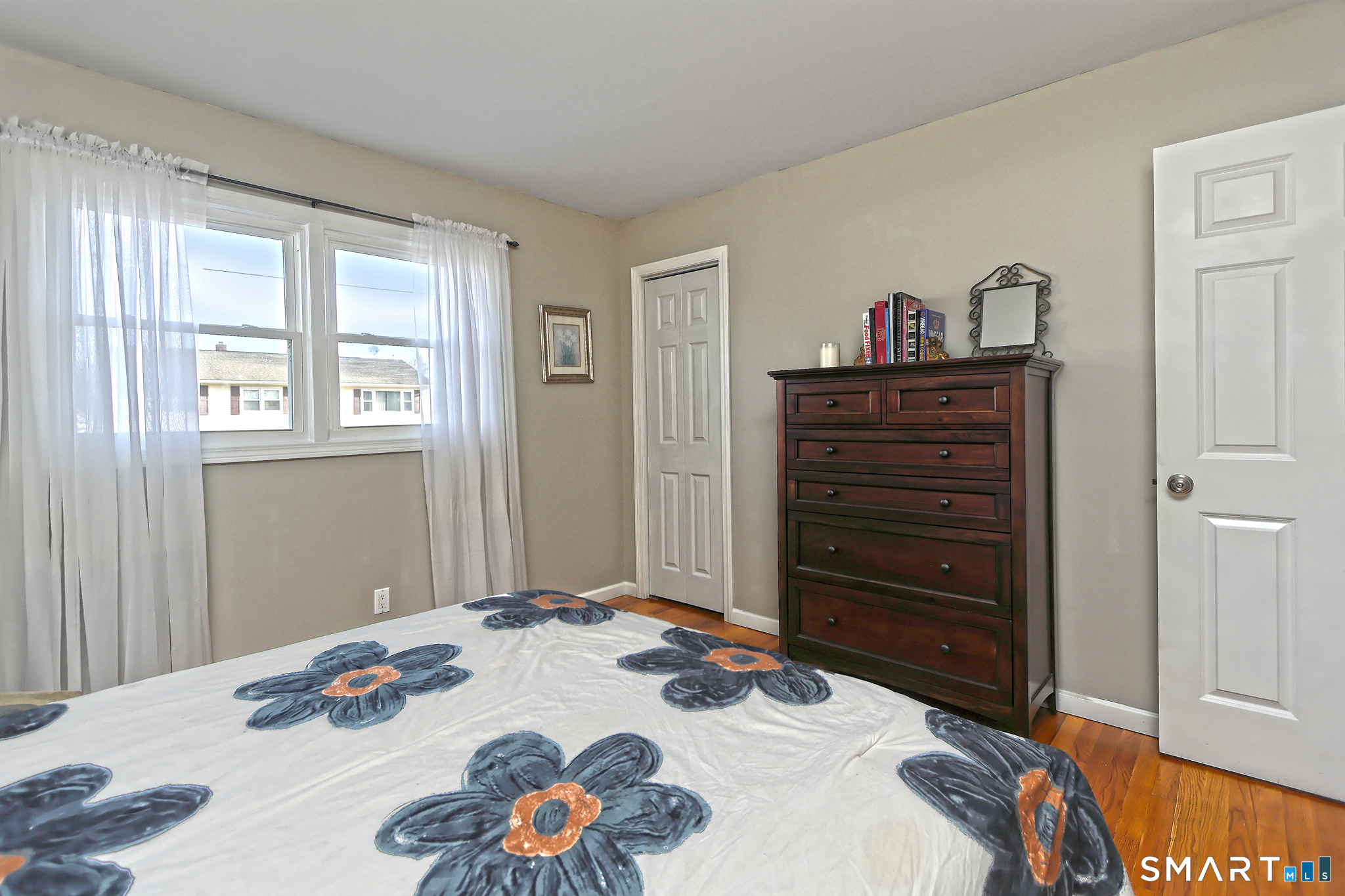 53 Pheasant Road West Haven, CT 06516 - Photo 17 of 39 a bedroom with a bed and a dresser