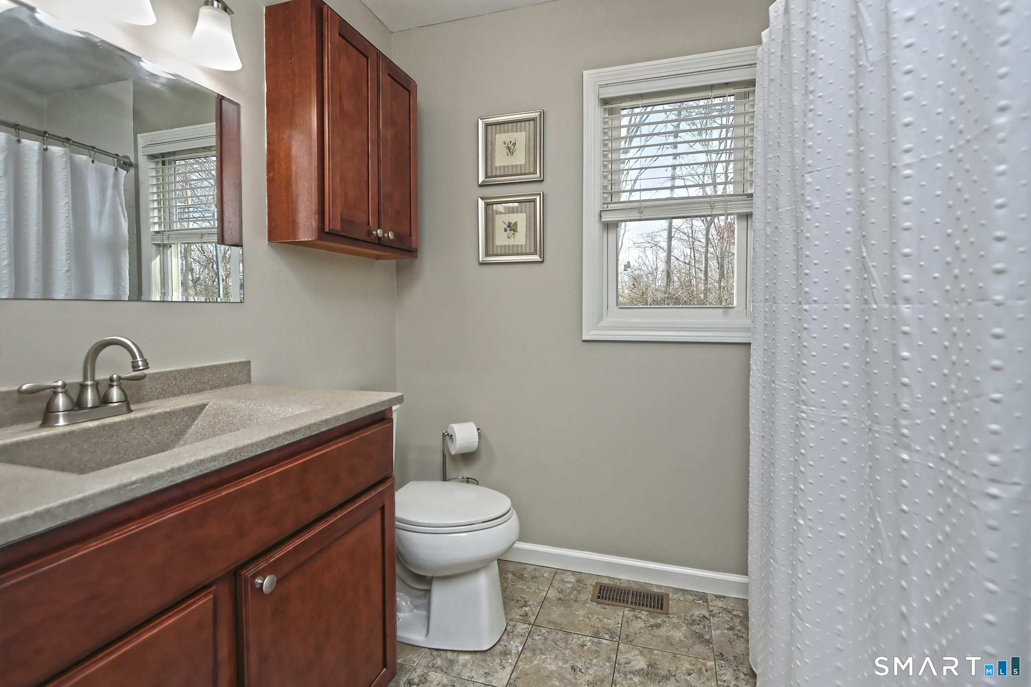 53 Pheasant Road West Haven, CT 06516 - Photo 18 of 39 a bathroom with a toilet a sink and mirror