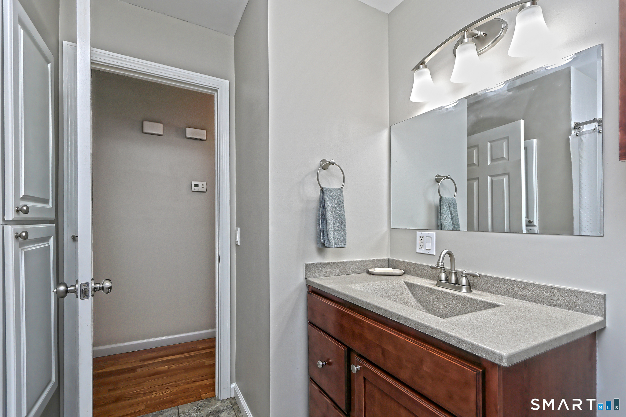 53 Pheasant Road West Haven, CT 06516 - Photo 19 of 39 a bathroom with a sink and a mirror