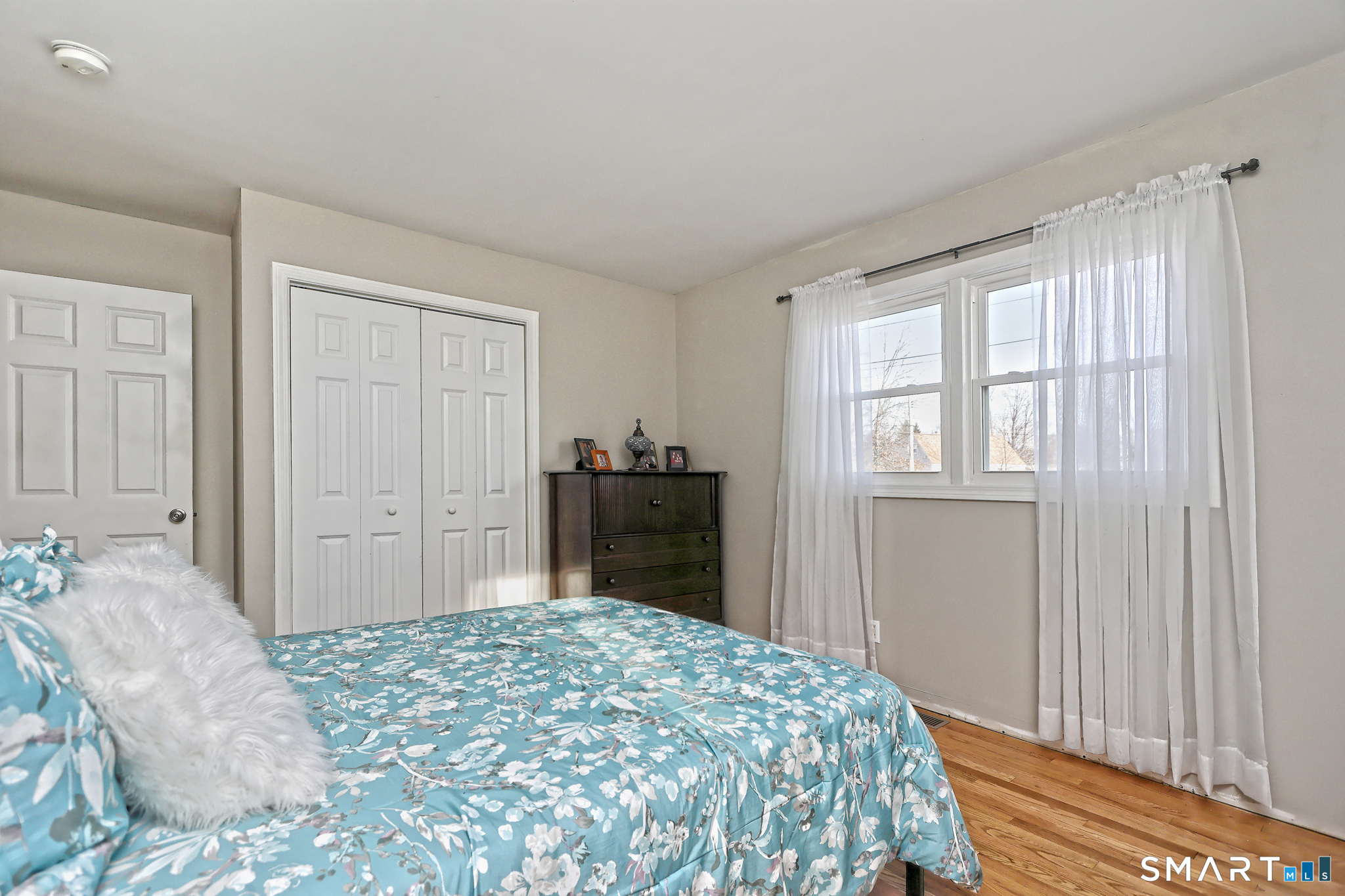 53 Pheasant Road West Haven, CT 06516 - Photo 21 of 39 a bedroom with a bed and a dresser