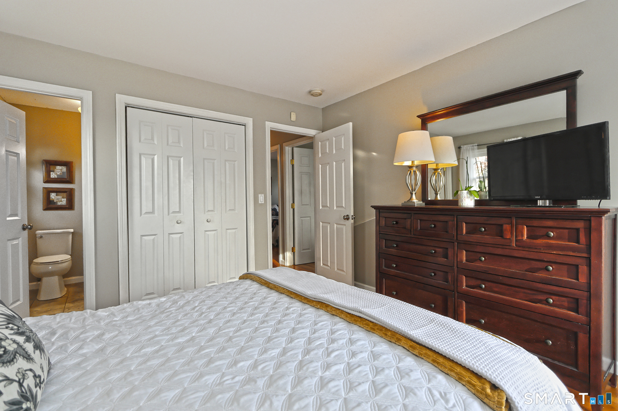 53 Pheasant Road West Haven, CT 06516 - Photo 25 of 39 a bedroom with a bed and a mirror on dresser