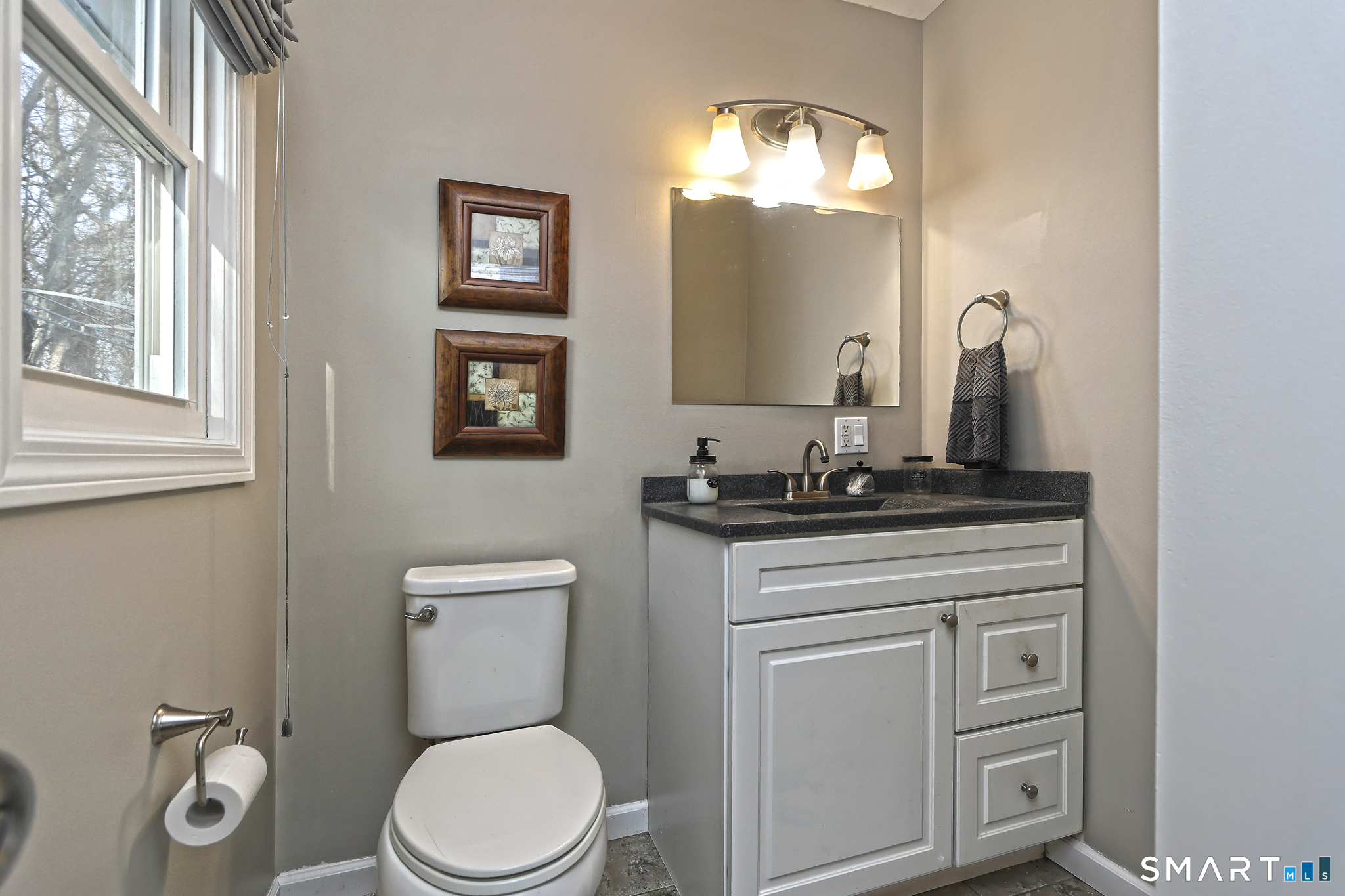 53 Pheasant Road West Haven, CT 06516 - Photo 26 of 39 a bathroom with a toilet a sink and mirror