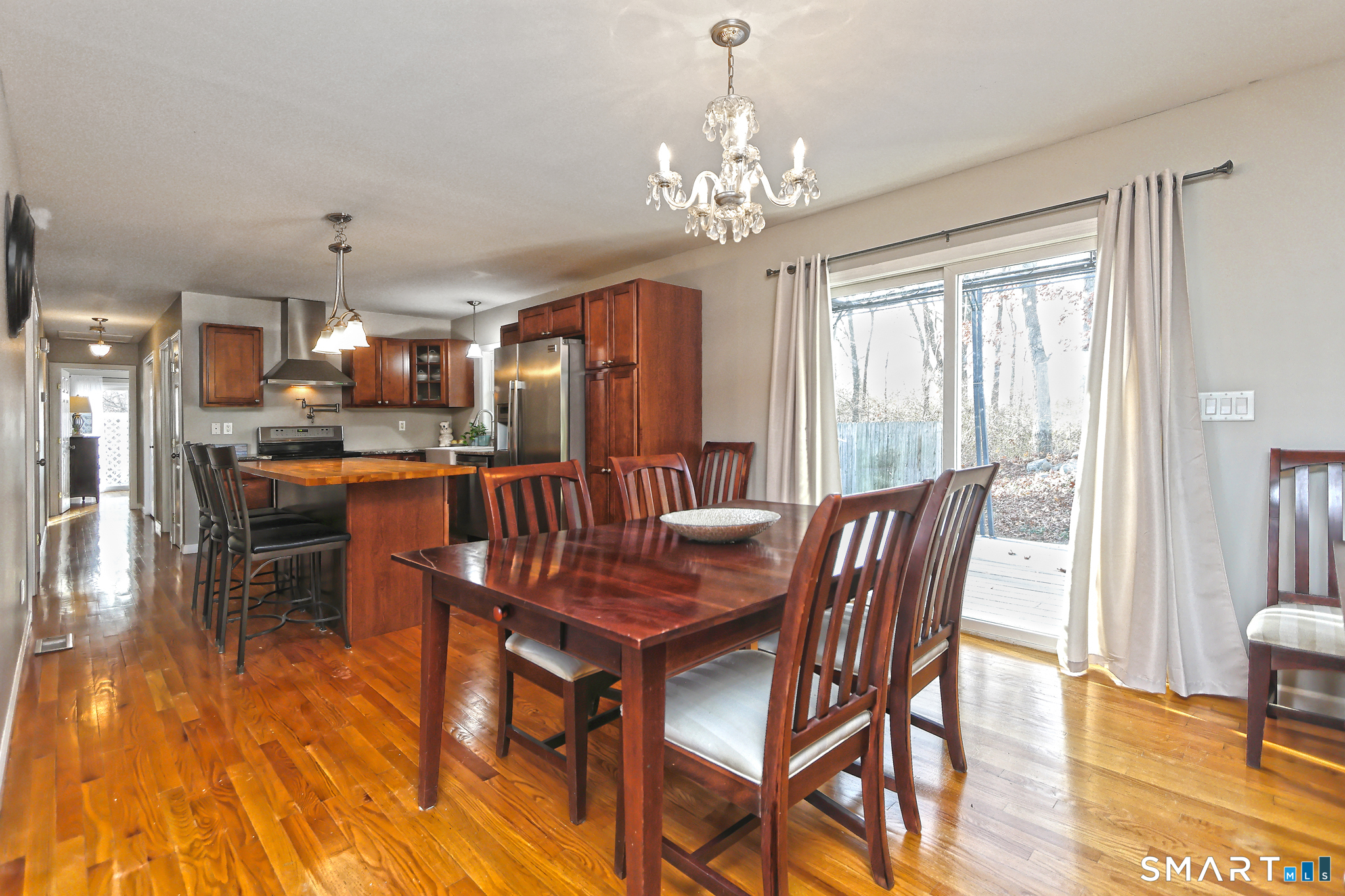 53 Pheasant Road West Haven, CT 06516 - Photo 9 of 39 a view of a dining room with furniture window and wooden floor