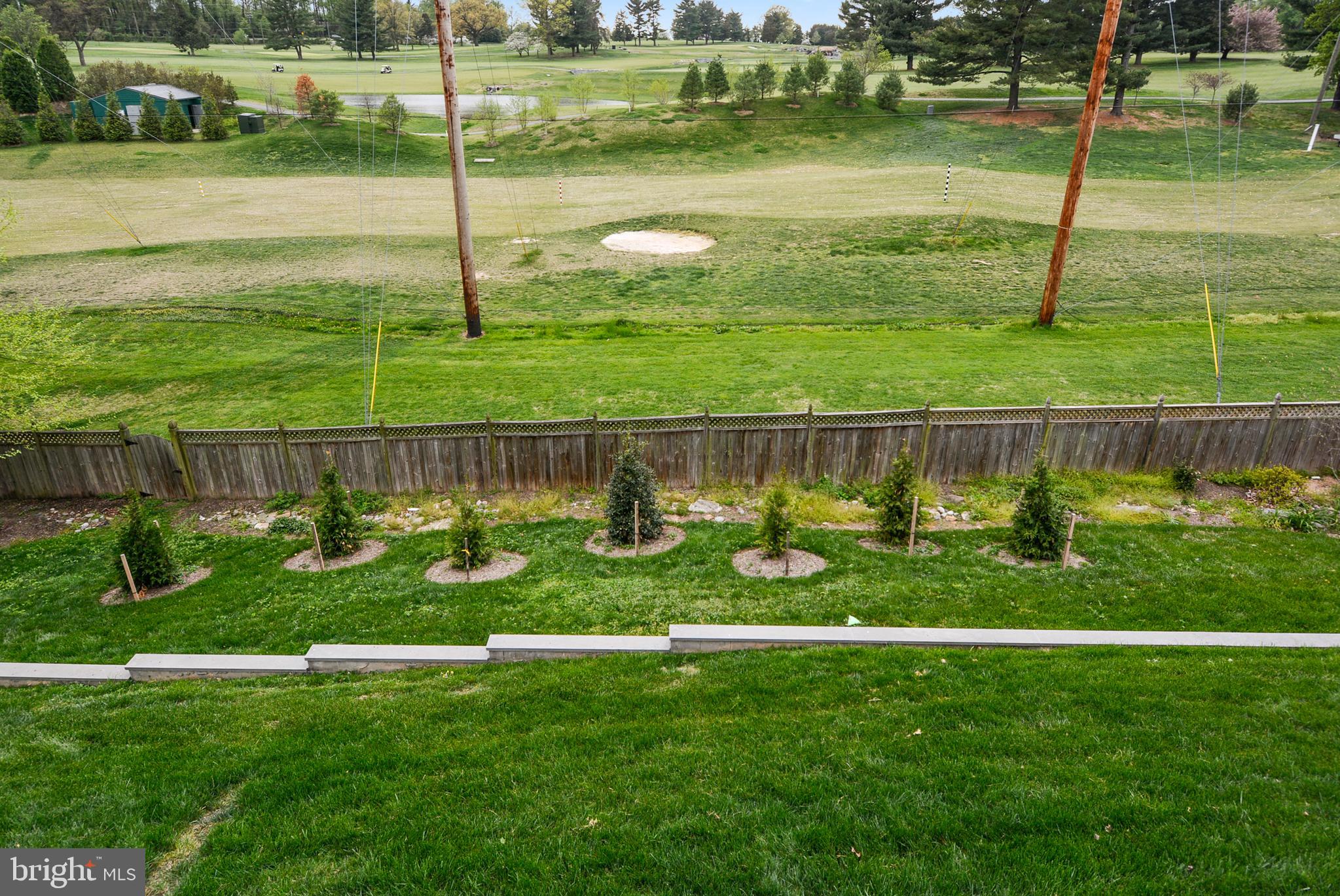 6420 Garnett Drive Chevy Chase, MD 20815 - Photo 23 of 37 Plantings and view of the driving range & beyond