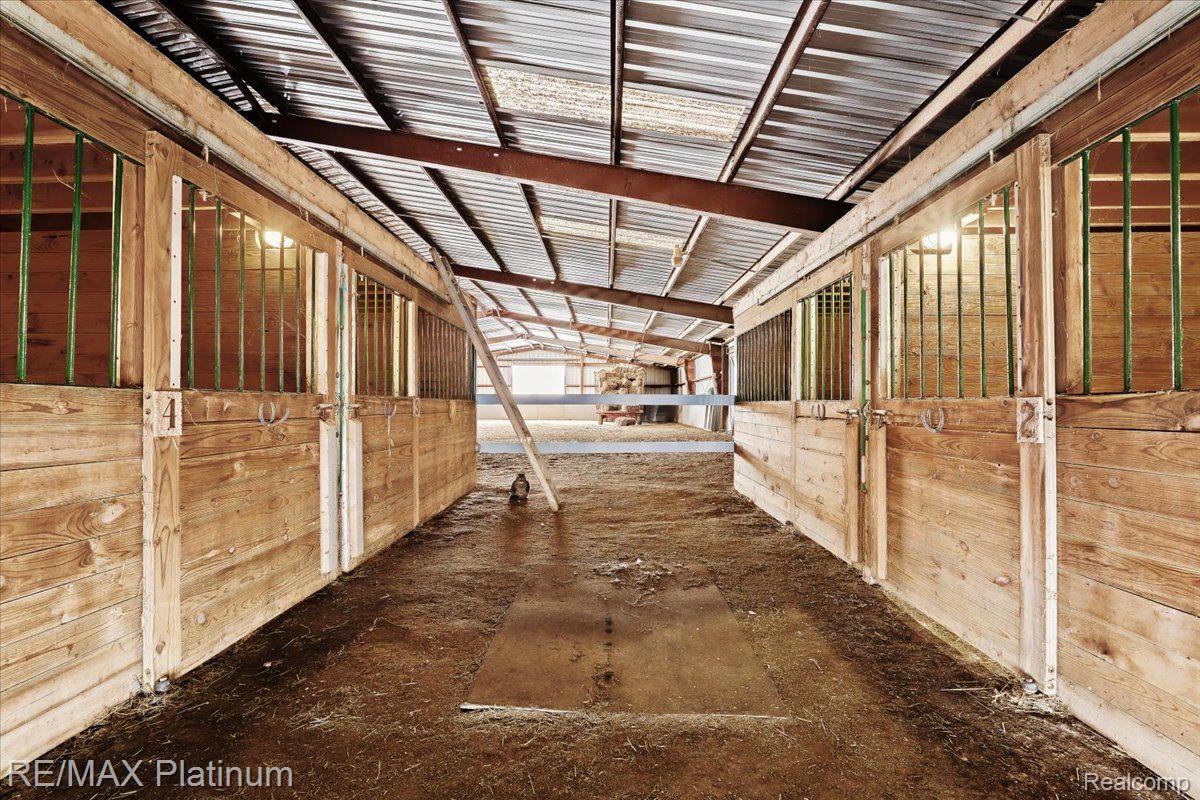 3566 Curdy Road Howell, MI 48855 - Photo 40 of 57 Hay lofts are above the horse stalls