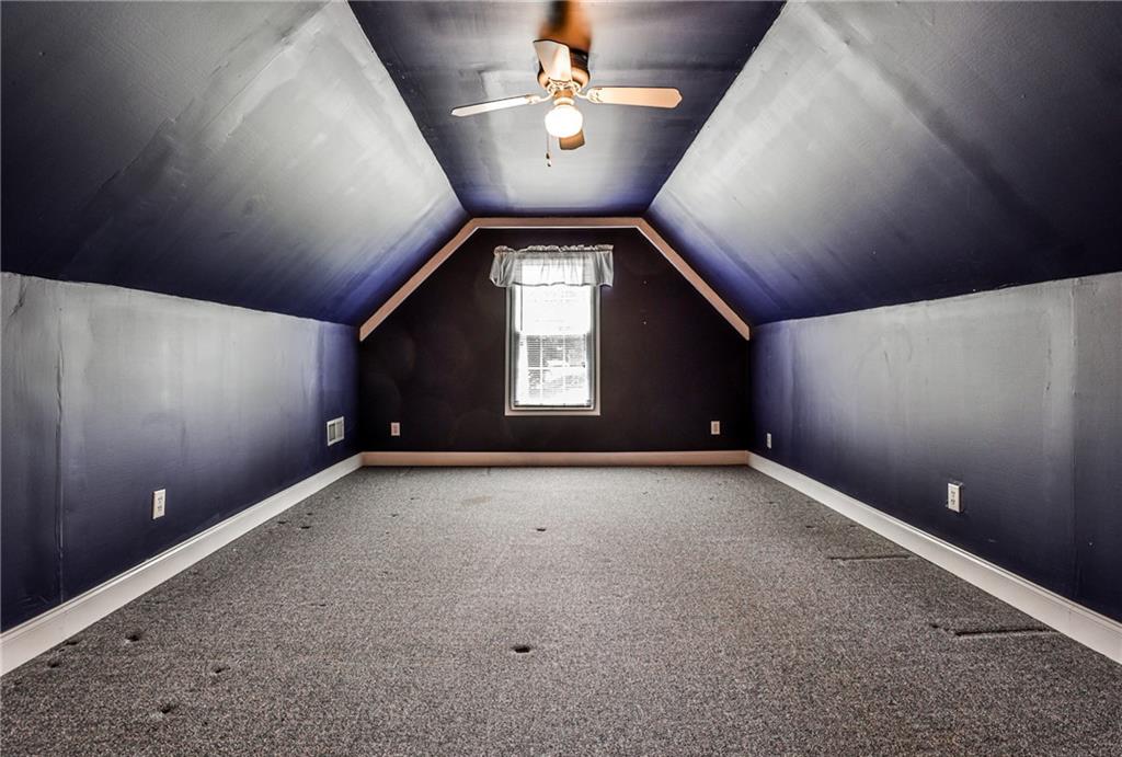 1505 Heatherton Road Dacula, GA 30019 - Photo 20 of 33 a view of an empty room and a ceiling fan