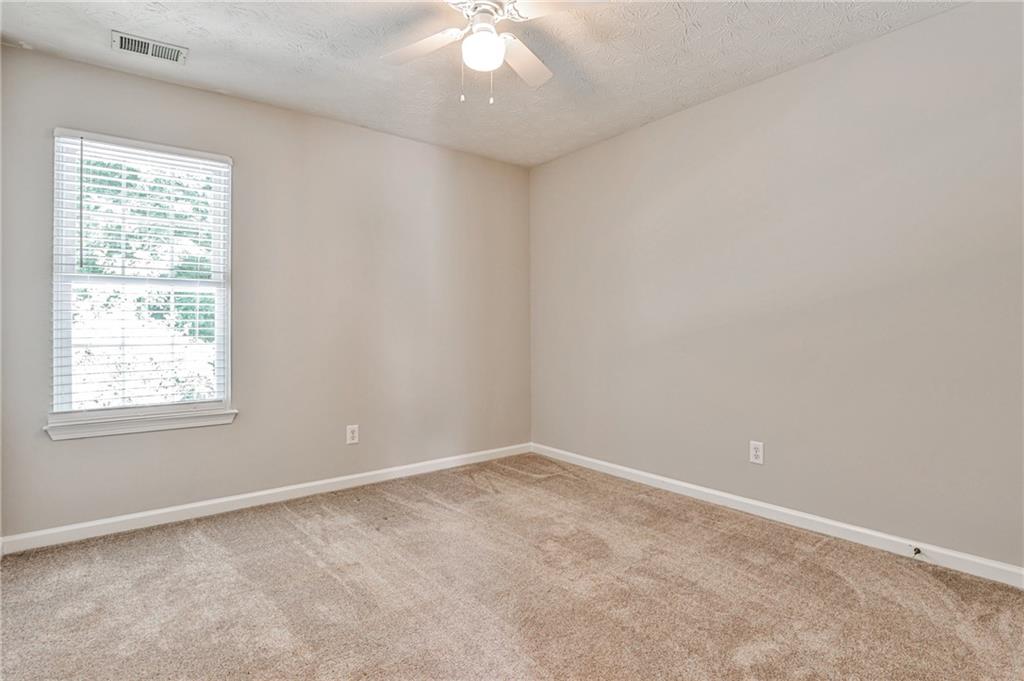 1505 Heatherton Road Dacula, GA 30019 - Photo 22 of 33 an empty room with a window