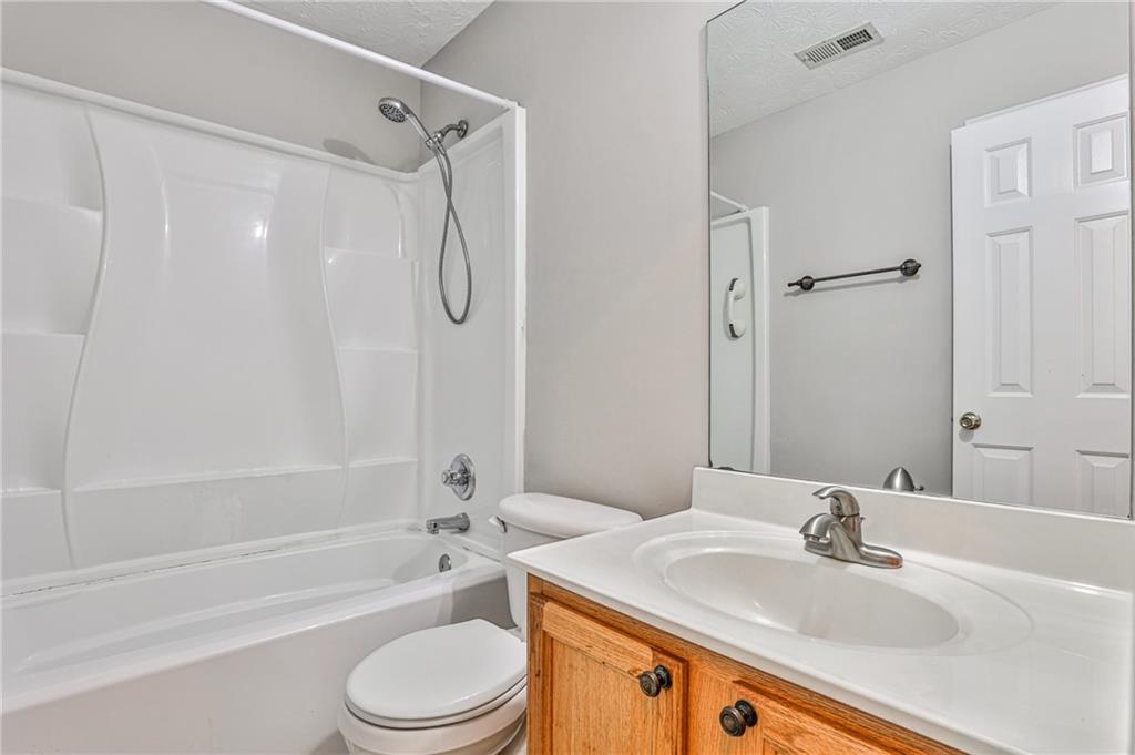 1505 Heatherton Road Dacula, GA 30019 - Photo 23 of 33 a bathroom with a sink toilet and a bathtub