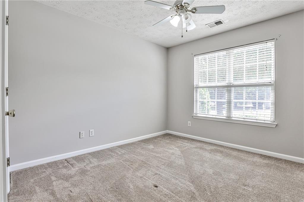 1505 Heatherton Road Dacula, GA 30019 - Photo 24 of 33 a view of an empty room with a window