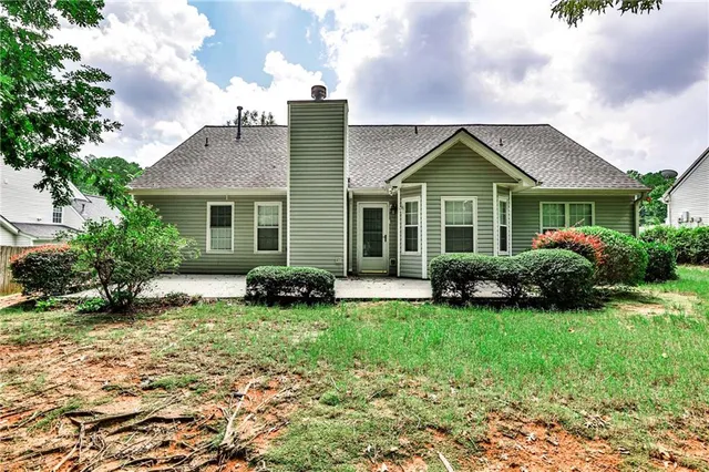 a house view with a garden space