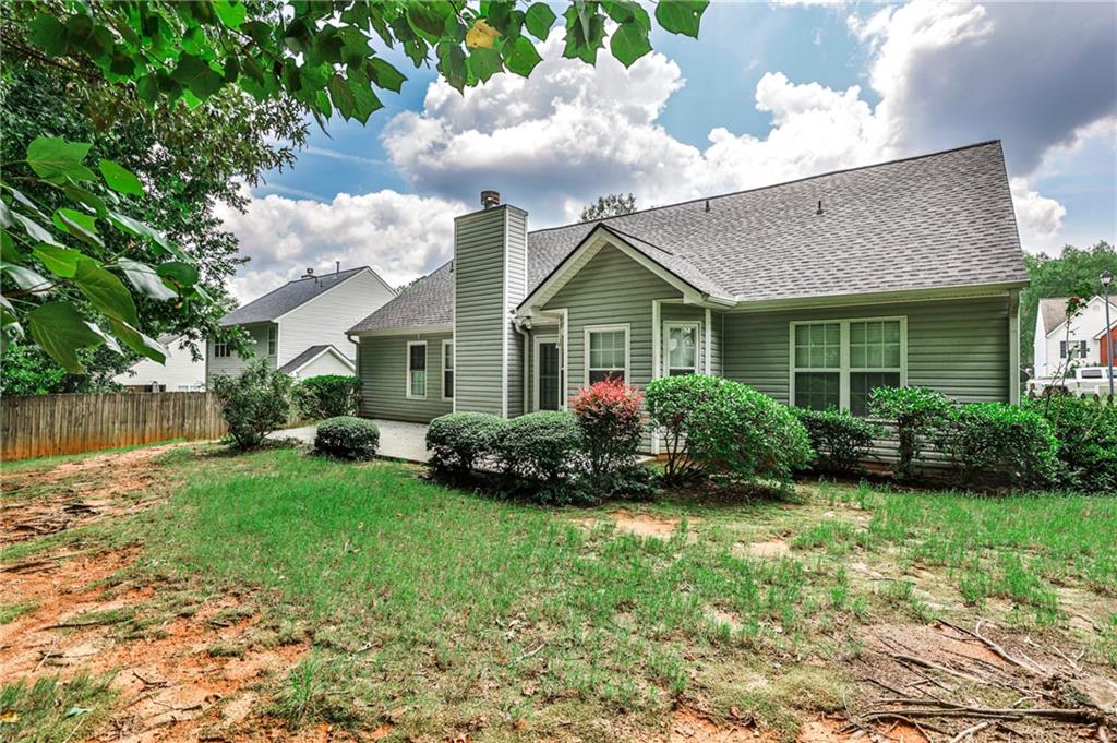 1505 Heatherton Road Dacula, GA 30019 - Photo 26 of 33 a view of a house with backyard and garden