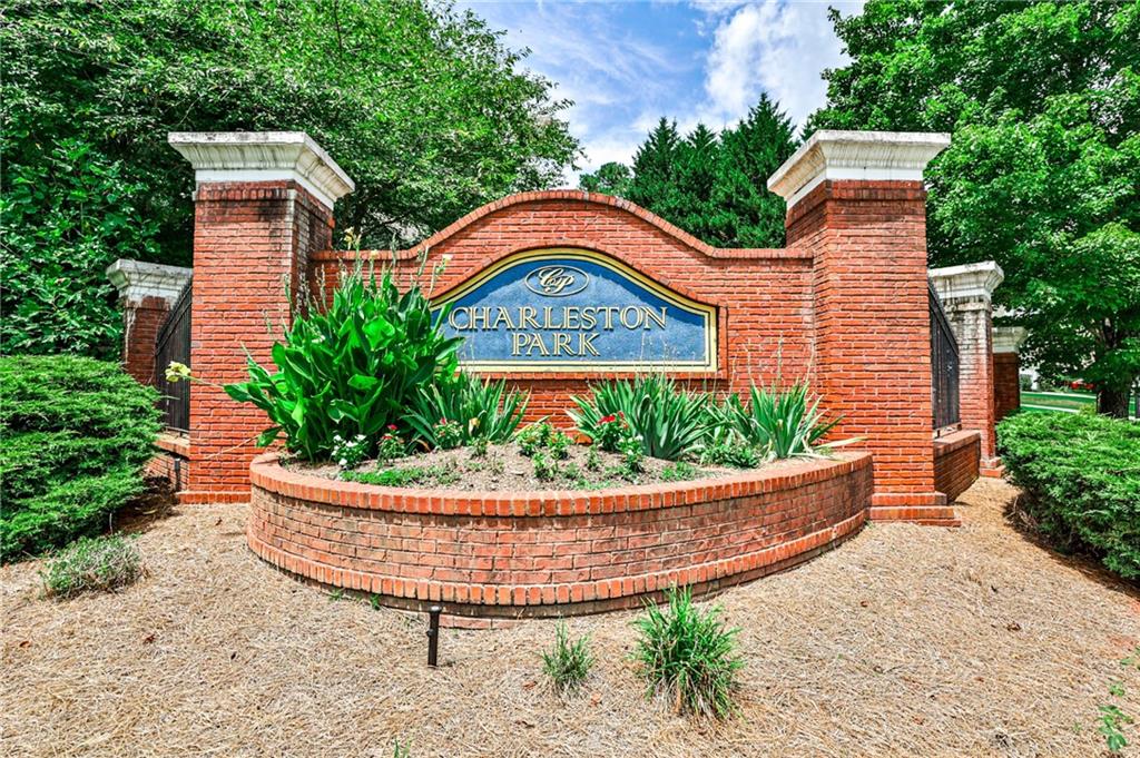 1505 Heatherton Road Dacula, GA 30019 - Photo 28 of 33 a front view of a house with a garden