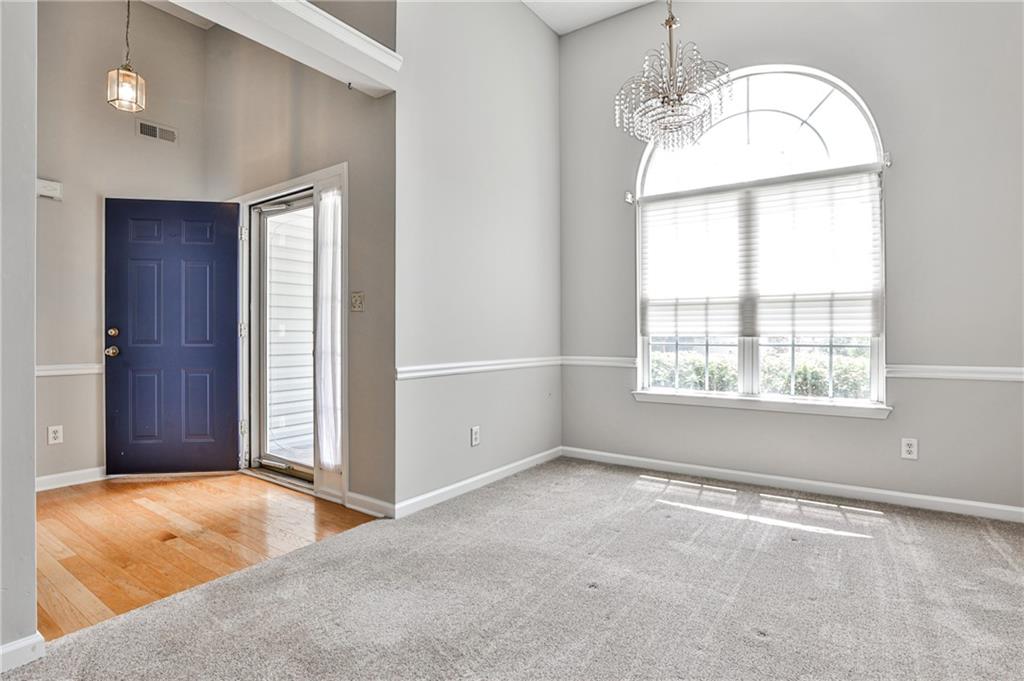 1505 Heatherton Road Dacula, GA 30019 - Photo 6 of 33 an empty room with a window