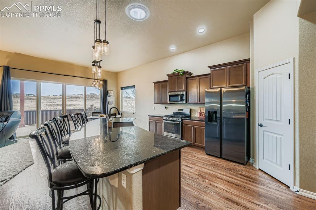 10625 Slumber Ridge Way Colorado Springs, CO 80908 - Photo 7 of 36 Open, inviting cooks kitchen