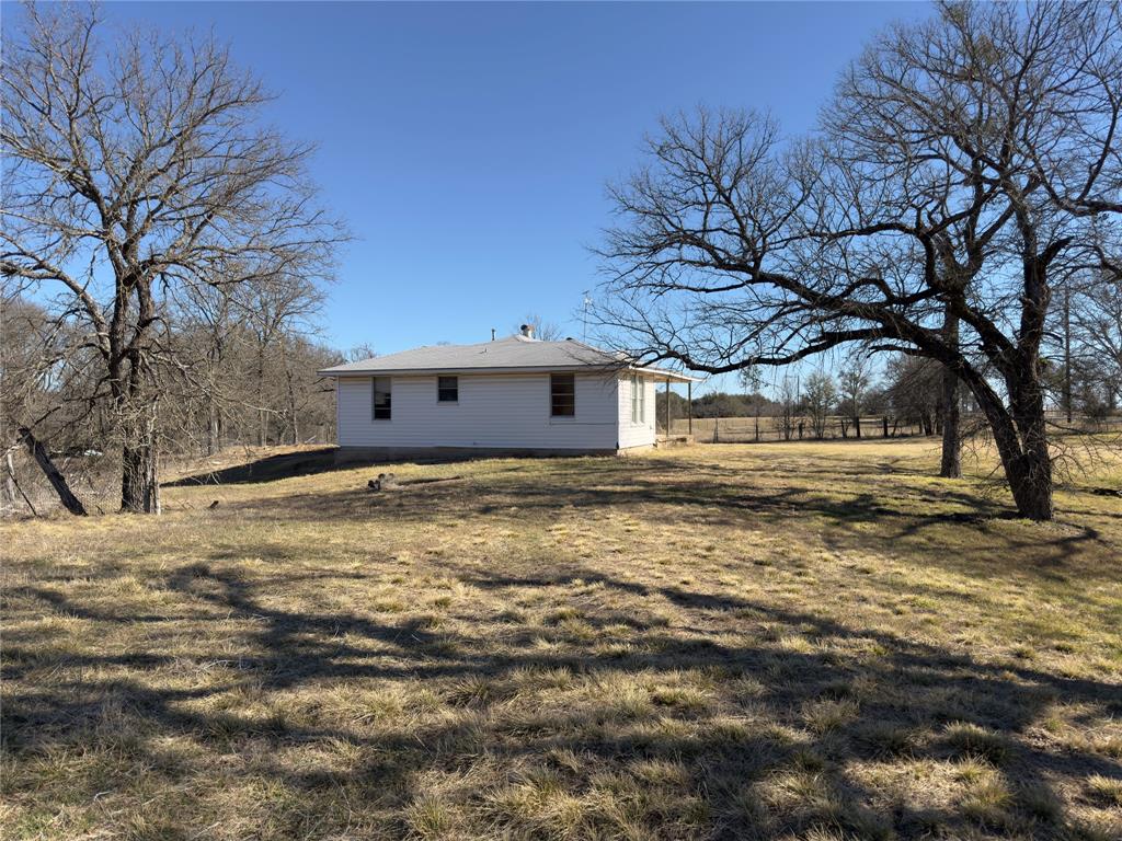 3697 North Rock Creek Loop Waco, TX 76708 - Photo 8 of 30 a view of a house with a yard