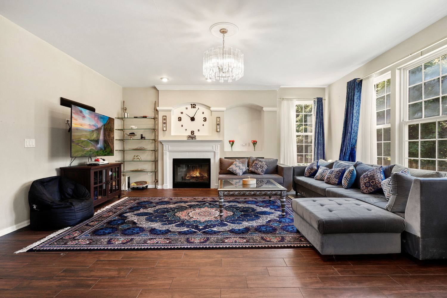320 Claridge Circle Bolingbrook, IL 60440 - Photo 2 of 27 a living room with furniture a fireplace and a flat screen tv