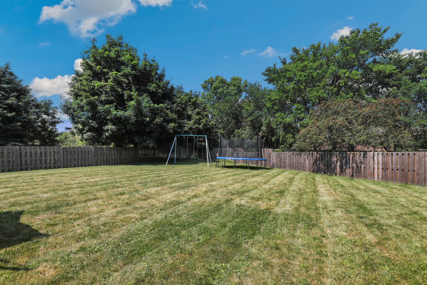320 Claridge Circle Bolingbrook, IL 60440 - Photo 25 of 27 a swimming pool with trees in the background