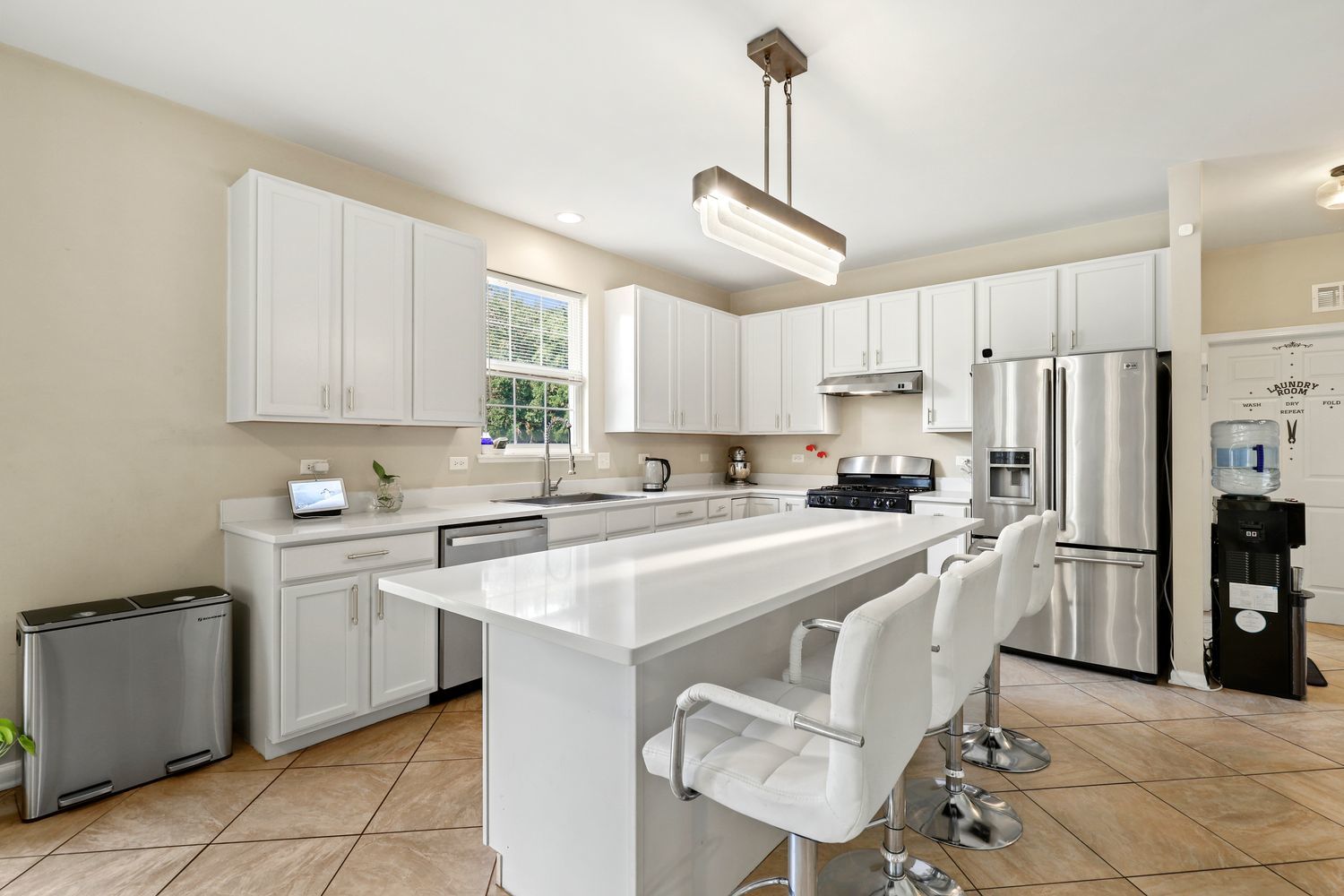 320 Claridge Circle Bolingbrook, IL 60440 - Photo 5 of 27 a kitchen with refrigerator cabinets and chairs